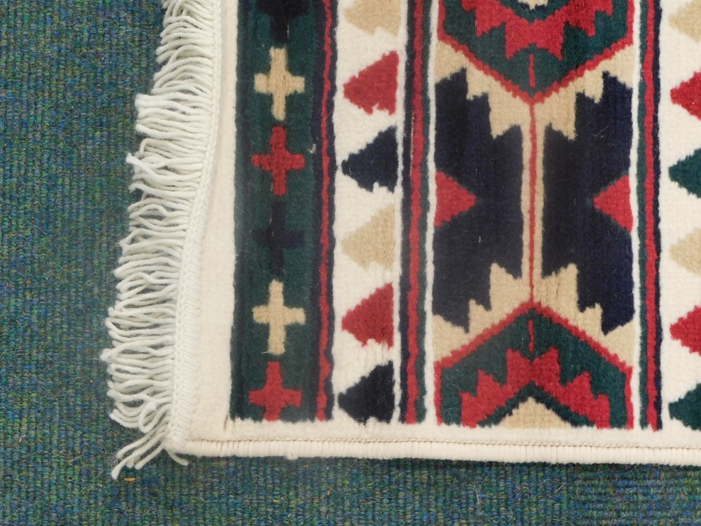 A modern rug, with a geometric design on a cream ground, 119cm x 165cm. - Image 2 of 3