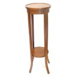 An Edwardian mahogany and boxwood strung two tier plant stand, on splayed legs, 95cm high.
