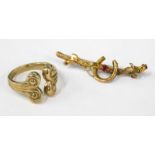 A 9ct gold Celtic style ring, with reeded decoration and a bar brooch cast with a horseshoe and inse