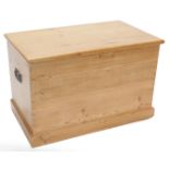 A stripped pine blanket box, the rectangular lid enclosing a vacant interior, on a plinth, 85cm wide
