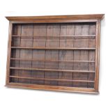 A late 18th/early 19thC oak plate rack, with a moulded cornice above three plate shelves each with a