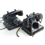 Two black Bakelite telephone cases, 18cm wide. (2, AF)