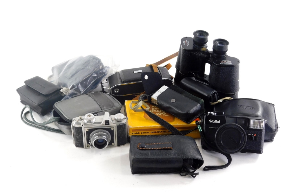 A quantity of cameras and binoculars, to include some digital.