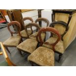 A set of six 19thC walnut balloon back dining chairs, with drop in seats on turned legs, (6).