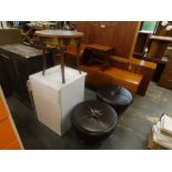 A circular topped occasional table, and two leatherette footstools. The upholstery in this lot does