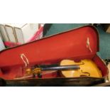 A two piece violin and bow, cased.