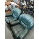 A pair of green leather armchairs.