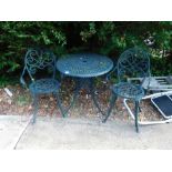 A metal garden table and two chairs.