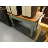 A pine kitchen table, with a pale blue painted base on turned legs, the top 80cm x 118cm. (drawer mi