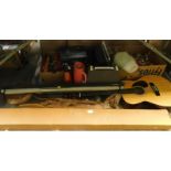 An acoustic guitar, various vintage Christmas decorations, Trival Pursuit, fabric, copper and brass