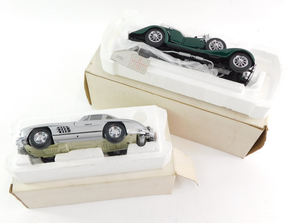 A Franklin Mint die cast precision model of a 1954 Mercedes Benz 300SL, together with a 1938 Alvis 4