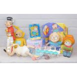 A group of collectors toys, to include a Teletubbies yellow Teletubby figure, a Rugrats Child, a