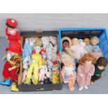 A group of dolls, to include a plastic headed clown, plastic headed and papier mache dolls, clown fi