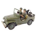 A Japanese mid century tin plate US army jeep, with two soldiers and a gun to the rear, battery oper