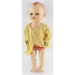A Pedigree doll, 52cm high.