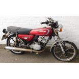 A Kawasaki KH100EX motorcycle, registration NRC73W, mileage on clock 471.2miles.