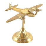 An aeronautical brass desk stand, modelled as an Avro Anson, 15cm wide.