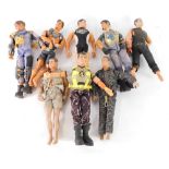 Eight Action Men figures, variously attired.