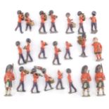 A group of Britains lead Coldstream Guards band figures, together with three Scottish soldiers, and