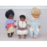 Three plastic collectors dolls, to include Eskimo type figure, and two in dress. (3)