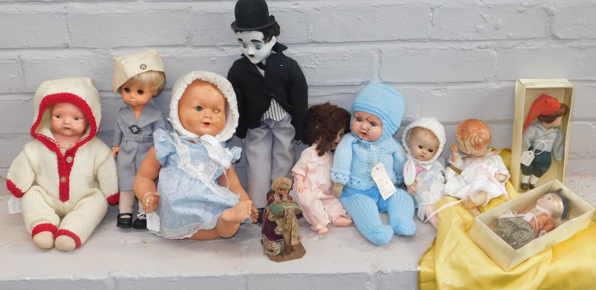 A group of various dolls, to include a plastic St Johns Ambulance model, various part ceramic dolls,