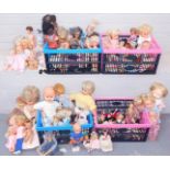 A group of various dolls, mainly play worn and some with damp damage, mainly plastic with some moder