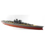 A scale model of a Japanese WWII battle ship, possibly The Yamato, modeled with armourments, deck pl