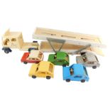 A scratch built painted wooden model of a car transporter, together with five cars. (6)