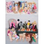 A group of Barbie, Sindy, and Action Men. (1 box)