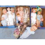 A group of dolls, to include a ceramic eastern figure of a lady in pink dress, plastic dress models,