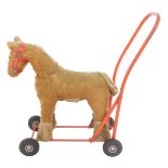 A Lines Bros mid century push-a-long horse, on a red frame, on wheels.