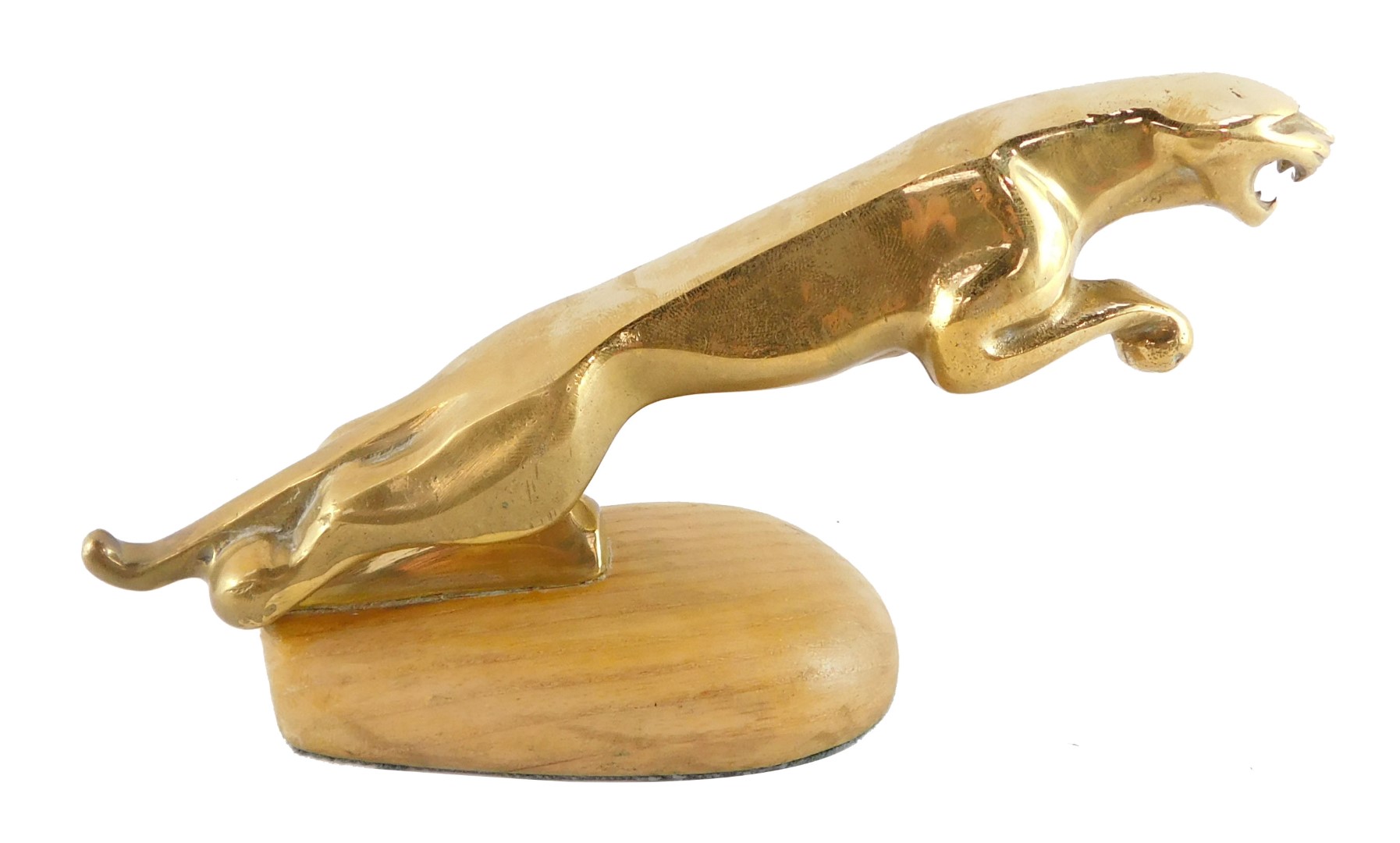 A brass desk stand, modelled as a Jaguar car mascot, 18.5cm wide.