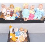 A group of dolls, to include all plastic bodied dolls, three large and various medium and small size