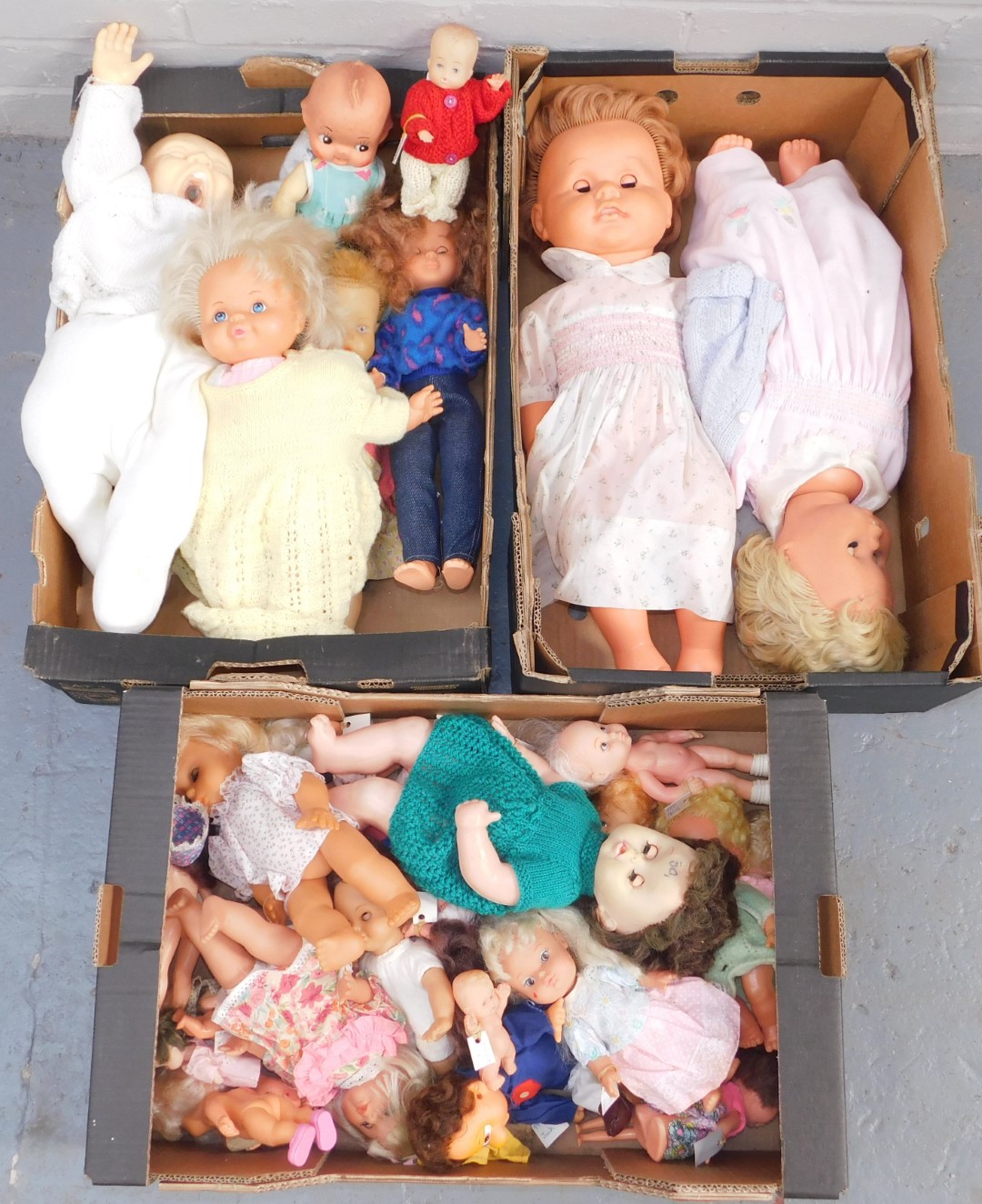 A group of dolls, to include all plastic examples, to include screaming baby, medium size and large,