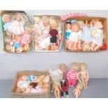 A group of various dolls, to include a bubbles doll, various small medium sized doll figures, all pl