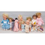 A small group of dolls, to include a plastic headed Mattel and material bodied baby, various other p