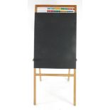 A child's pine A frame chalk board, with chalk, and abacus, 108cm high.