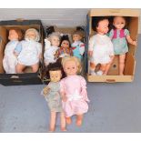 A group of plastic dolls, each of varying design but large in proportion, with varying dress. (3 box