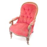A Victorian mahogany show frame armchair, with button back padded arms and seats, turned legs on cas