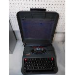 A cased typewriter.