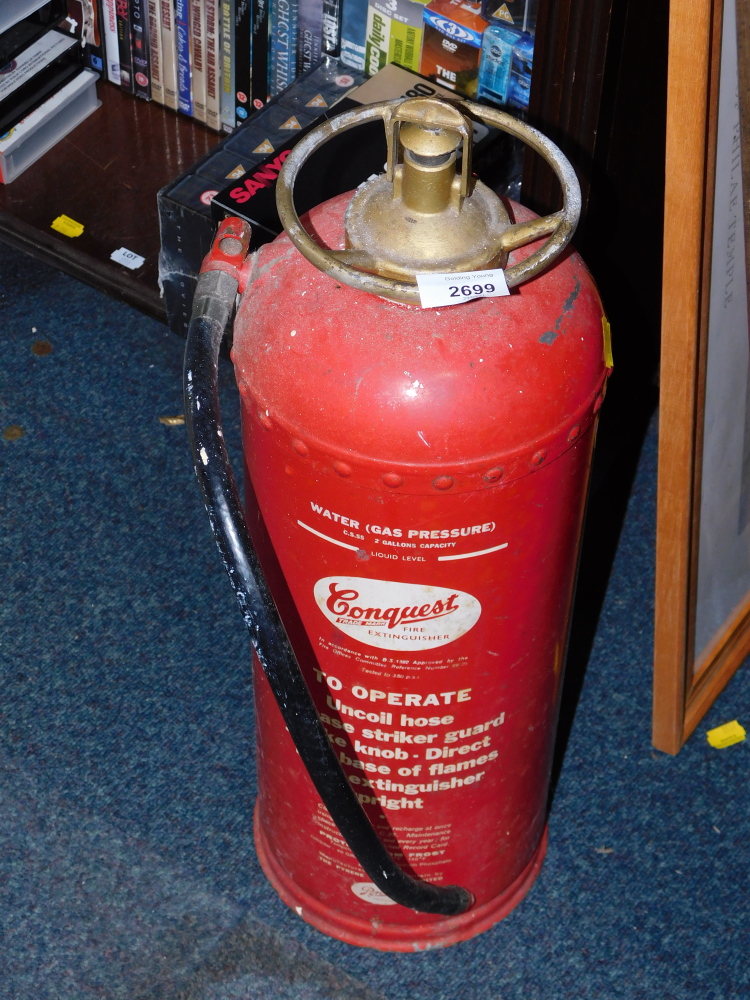 A Conquest vintage fire extinguisher.