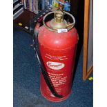 A Conquest vintage fire extinguisher.