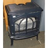 A cast iron gas stove heater, model Jotul GF300CF.