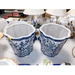 A pair of fluted blue and white ironstone jardinieres, fronted with fruit and birds.