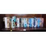 Terry Pratchett paperback books, to include The Enchanted Affair., Blue Murder., etc. (1 shelf)