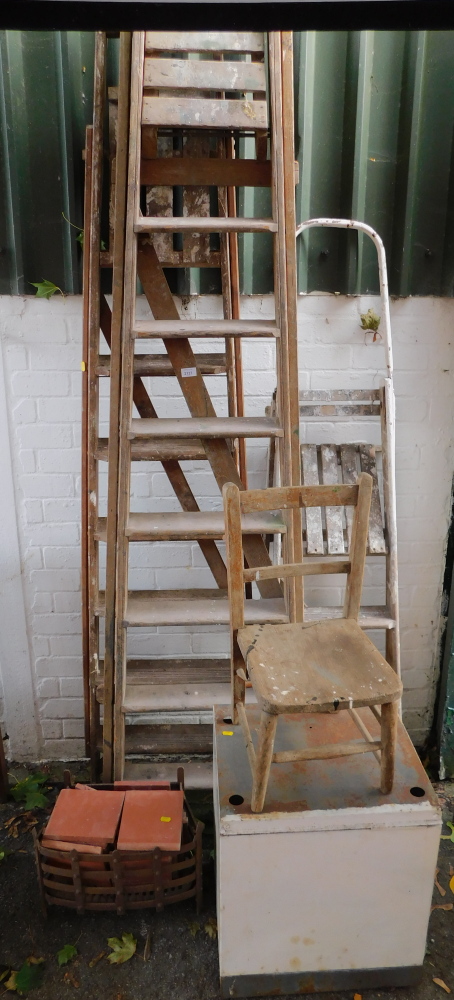 Three step ladders, a child's chair, terracotta tiles, fire basket and a cupboard. (6)