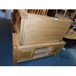 A blonde oak coffee table, together with an oak and oak veneered television stand. (2) NB. We have