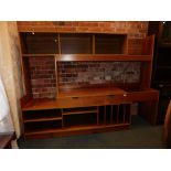 An extendable teak wall unit.