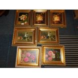 Seven gilt framed floral prints.