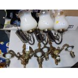 Wall lights, to include a set of three two branch gilt metal wall sconces, two single chrome finish